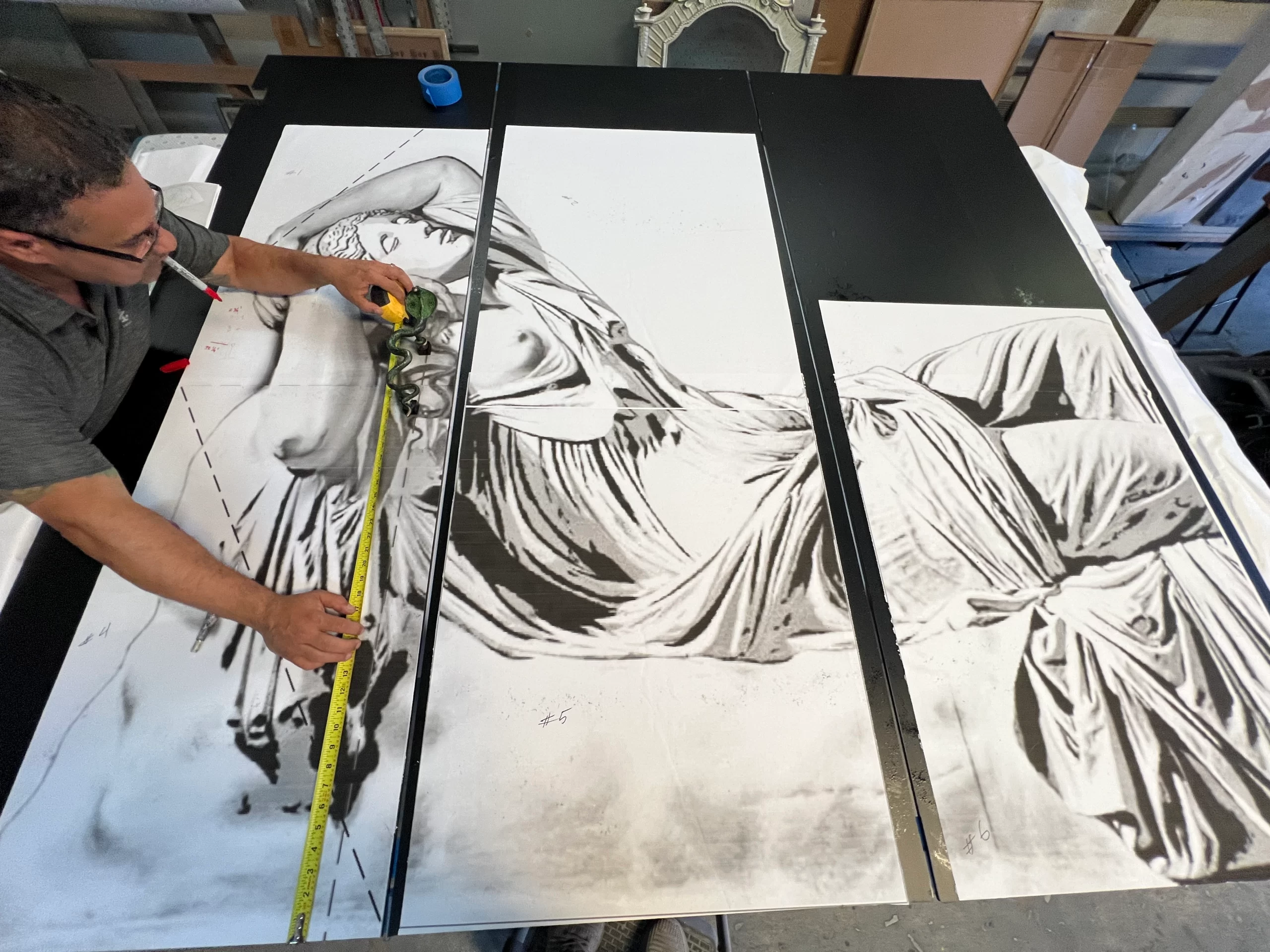 Custom glass shower door with Ariadne-inspired deep carving and snake handle